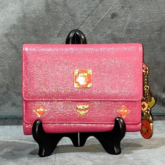 EUC MCM SAFFIANO LEATHER COMPACT WALLET DECORATIVE METAL MCM BAGDES & CHARMS